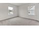 Bright bedroom with neutral carpet, natural light from windows at 5712 Agrinio Way, Raleigh, NC 27603