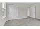 Spacious bedroom with double door closet and neutral carpet flooring at 5712 Agrinio Way, Raleigh, NC 27603