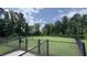 Community dog park with black fence and large grassy area for pets to run and play at 5712 Agrinio Way, Raleigh, NC 27603