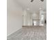 Carpeted living room with a staircase, neutral colors, and bright natural light at 5712 Agrinio Way, Raleigh, NC 27603