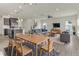 Open concept living space features a dining area and comfortable seating arrangement at 5712 Agrinio Way, Raleigh, NC 27603