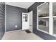 Covered patio with blue siding and a view inside the home at 5712 Agrinio Way, Raleigh, NC 27603