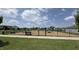Community playground area with bench, black fencing and various activities at 5712 Agrinio Way, Raleigh, NC 27603
