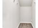Walk-in closet with wood-look flooring and lighting at 5712 Agrinio Way, Raleigh, NC 27603
