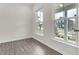 Bright living room featuring hardwood floors and large windows for ample natural light at 5712 Agrinio Way, Raleigh, NC 27603
