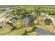 Scenic aerial view featuring pond, lush greenery, and residential architecture at 603 Goal Kick Dr, Fuquay Varina, NC 27526