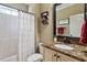 A bathroom featuring a shower/tub combo, single sink, granite countertops, and neutral paint at 603 Goal Kick Dr, Fuquay Varina, NC 27526