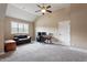 Spacious bonus room featuring a window, carpet, and flexible layout at 603 Goal Kick Dr, Fuquay Varina, NC 27526