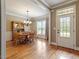 Traditional dining room featuring hardwood floors, a chandelier, and a charming wooden dining set at 603 Goal Kick Dr, Fuquay Varina, NC 27526