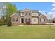 Classic two-story home with a well-maintained lawn and attractive brick and siding exterior at 603 Goal Kick Dr, Fuquay Varina, NC 27526