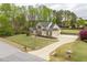Inviting home with a long driveway, attached garage, and well-maintained lawn at 603 Goal Kick Dr, Fuquay Varina, NC 27526