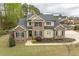 Charming two-story home with brick and siding exterior, nestled on a landscaped lot at 603 Goal Kick Dr, Fuquay Varina, NC 27526