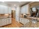 Updated kitchen boasts granite countertops, tile backsplash, stainless steel appliances, and modern cabinetry at 603 Goal Kick Dr, Fuquay Varina, NC 27526