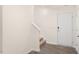 Bright entryway featuring hard surface floors, staircase, coat closet, and a white entry door at 6049 Sodium St, Raleigh, NC 27610