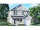 Charming two-story home with gray siding, a covered porch, attached garage and manicured landscaping at 6049 Sodium St, Raleigh, NC 27610