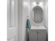 Cozy half bathroom featuring a vanity with storage and oval mirror at 622 Twain Town Dr, Knightdale, NC 27545