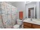 Hall bathroom featuring a single vanity, tub-shower combination, and plenty of light at 622 Twain Town Dr, Knightdale, NC 27545