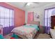 Colorful bedroom with bright accents, playful decor, and lots of natural light at 622 Twain Town Dr, Knightdale, NC 27545