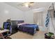Neutrally decorated bedroom with ceiling fan, carpet and space for a desk and dresser at 622 Twain Town Dr, Knightdale, NC 27545
