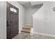 Cozy entryway featuring neutral tones, hardwood floors, staircase, and decorative accents at 622 Twain Town Dr, Knightdale, NC 27545