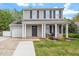 Inviting two-story home with a classic design, attached garage, and a well-kept front yard at 622 Twain Town Dr, Knightdale, NC 27545