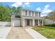 Inviting two-story home with a classic design, attached garage, and a well-kept front yard at 622 Twain Town Dr, Knightdale, NC 27545