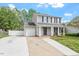 Attractive two-story home with a well-manicured lawn and an attached single car garage at 622 Twain Town Dr, Knightdale, NC 27545