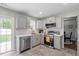 Updated kitchen with stainless steel appliances, white quartz countertops, and light gray cabinetry at 622 Twain Town Dr, Knightdale, NC 27545
