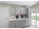 Contemporary kitchen with gray cabinets, quartz counters and stainless steel appliances at 622 Twain Town Dr, Knightdale, NC 27545