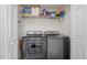 Convenient laundry area with washer, dryer, and storage shelves at 622 Twain Town Dr, Knightdale, NC 27545