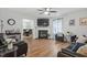 Spacious living room with a fireplace, hardwood floors, and comfortable seating at 622 Twain Town Dr, Knightdale, NC 27545