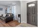 Living room featuring a modern door, hardwood floors, and neutral color palette at 622 Twain Town Dr, Knightdale, NC 27545