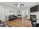 Cozy living room with fireplace, hardwood floors, and contemporary furnishings at 622 Twain Town Dr, Knightdale, NC 27545