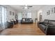 Inviting living room with hardwood floors, two leather sofas and contemporary decor at 622 Twain Town Dr, Knightdale, NC 27545