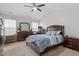 Comfortable main bedroom with ample natural light, carpet flooring and ceiling fan at 622 Twain Town Dr, Knightdale, NC 27545