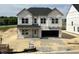 Two story home with a front yard and two car garage in a development at 705 Compeer Way # 31, Rolesville, NC 27571