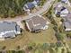 An aerial view shows a well-maintained home with a large yard and a screened porch in a suburban neighborhood at 7825 Green Hope School Rd, Cary, NC 27519