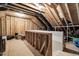 Unfinished attic space showing exposed beams and framing, offering potential for customization at 7825 Green Hope School Rd, Cary, NC 27519
