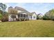 Expansive backyard featuring a well-maintained lawn and mature trees, perfect for outdoor activities and relaxation at 7825 Green Hope School Rd, Cary, NC 27519