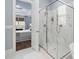 The bathroom features a shower with white tile, marble floors, and an entrance to the bedroom at 7825 Green Hope School Rd, Cary, NC 27519