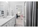 Bathroom with marble counters, tub, and shower featuring a shower curtain and doorway to bedroom at 7825 Green Hope School Rd, Cary, NC 27519