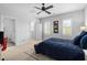 Bedroom with a large bed, ceiling fan, and large windows that provide plenty of natural light at 7825 Green Hope School Rd, Cary, NC 27519