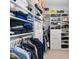 Walk-in closet featuring built-in shelving, drawers, and hanging racks for optimal storage solutions at 7825 Green Hope School Rd, Cary, NC 27519