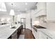 Well-lit kitchen featuring stainless steel appliances and a spacious island at 7825 Green Hope School Rd, Cary, NC 27519