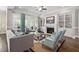 Cozy living room with a fireplace, built-in shelves, and large windows for natural light at 7825 Green Hope School Rd, Cary, NC 27519