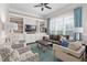 Spacious living room with built-in shelving, a comfortable couch, and natural lighting at 7825 Green Hope School Rd, Cary, NC 27519