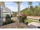 Inviting front porch with stone flooring, black railings, and neighborhood views at 7825 Green Hope School Rd, Cary, NC 27519