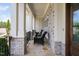 Charming front porch with stone accents, wicker chairs, and views of the neighborhood at 7825 Green Hope School Rd, Cary, NC 27519