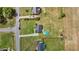 Overview of the property with a sizable yard featuring a pool and deck in a suburban setting at 82 Sommerset Dr, Clayton, NC 27520