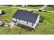 Aerial view showcasing the home's backyard, deck, and landscaping against a lush green lawn at 82 Sommerset Dr, Clayton, NC 27520